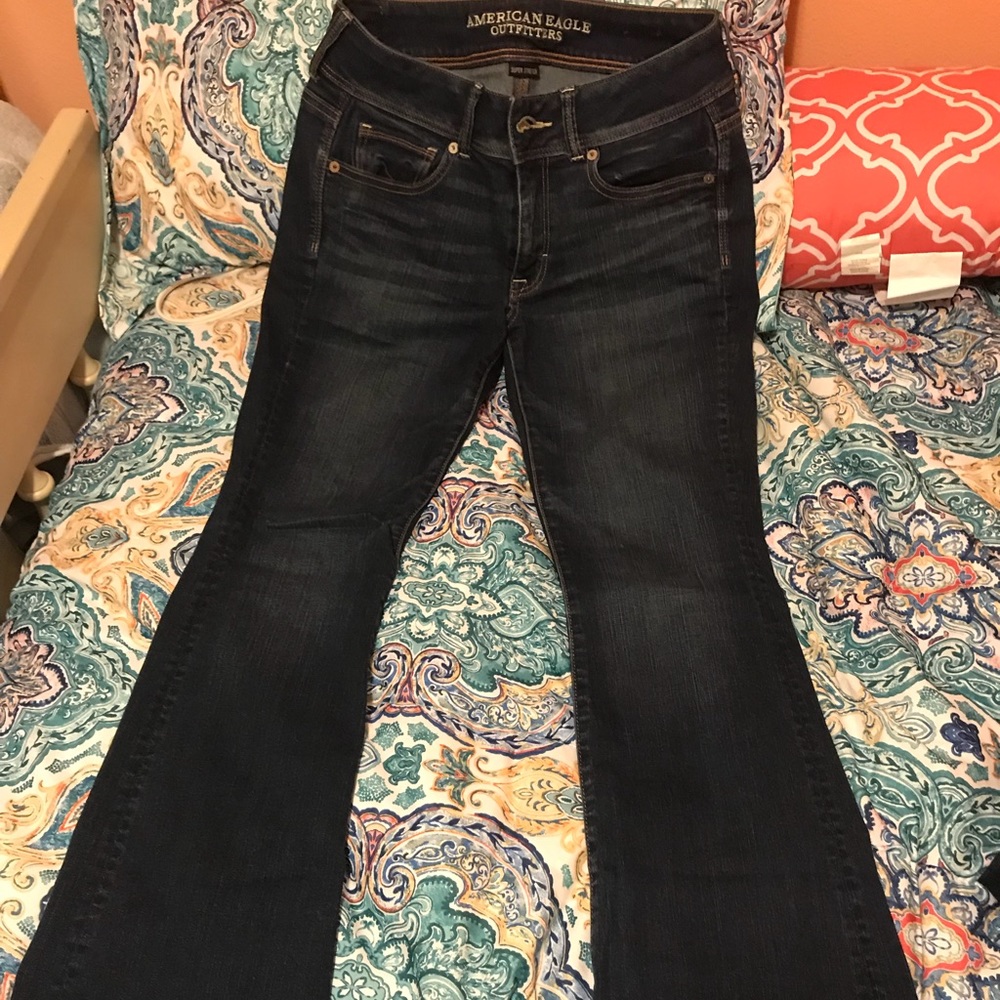 Two pairs of American Eagle jeans.